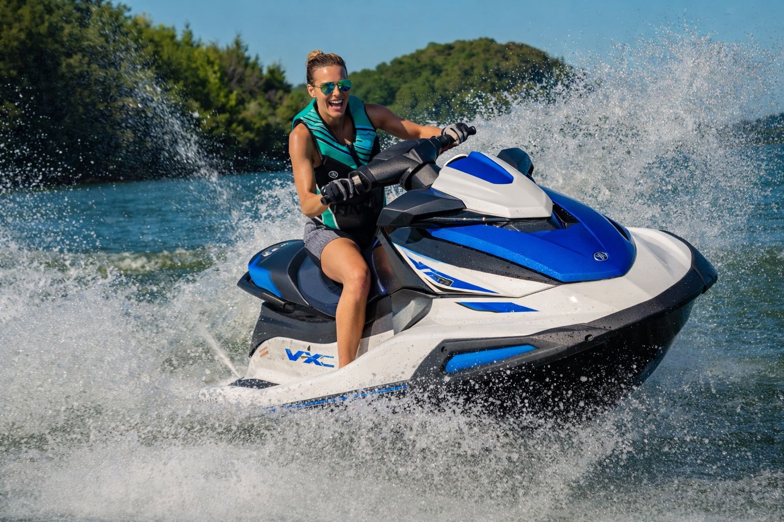 Guest riding a jet-ski through sea spray